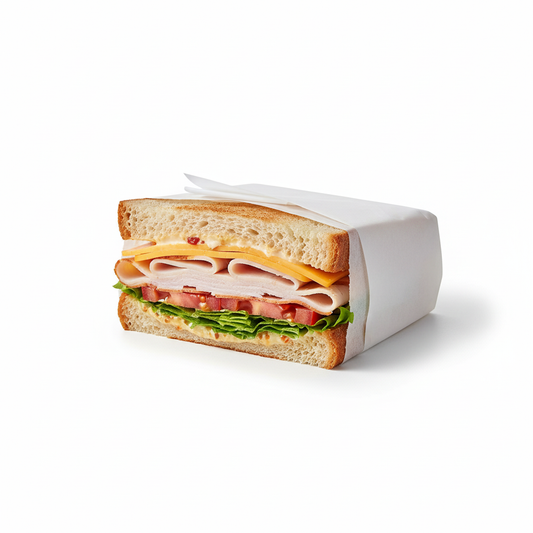 Half sandwich wrapped in greaseproof paper