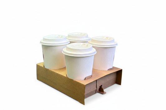 Four white coffee cups in carrier