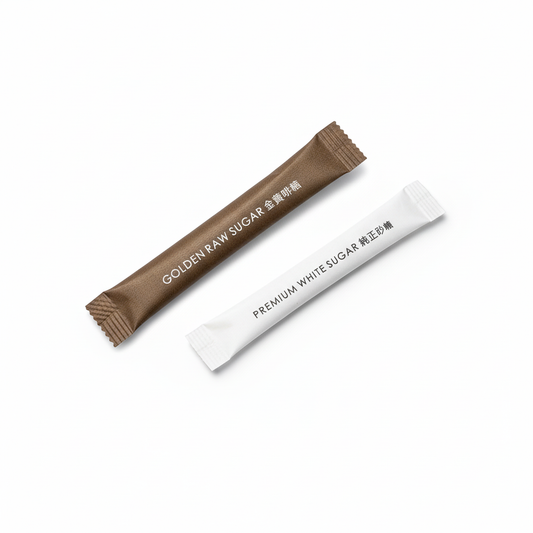 Golden raw sugar and premium white sugar packets combined