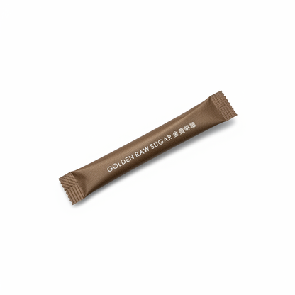 Golden raw sugar packet with original diagonal orientation